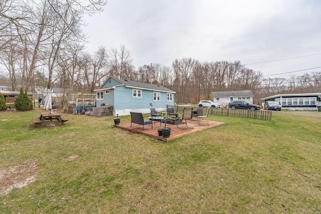 exterior space with a wooden deck and fence