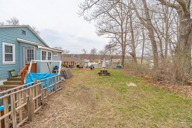 view of yard with fence and a deck
