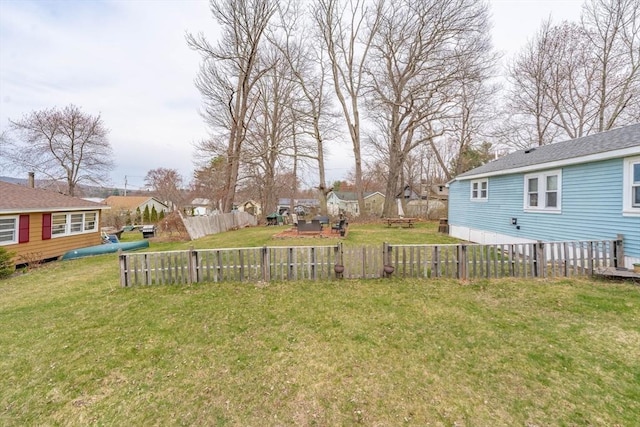 view of yard with fence and a residential view