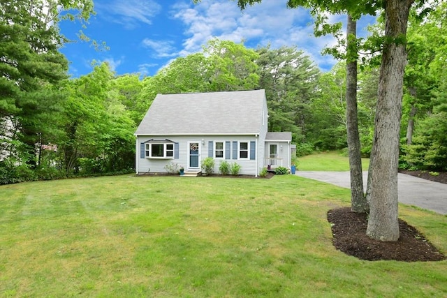 11 Winchester Ave, Bourne, MA 02532 - cape cod-style house with a front lawn, entry steps, and driveway
