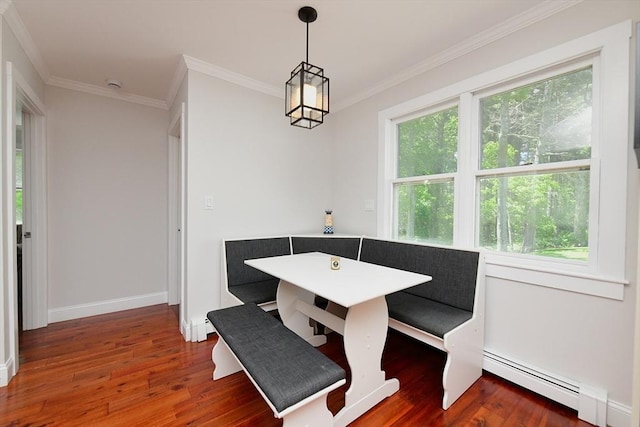11 Winchester Ave, Bourne, MA 02532 - unfurnished dining area with breakfast area, wood finished floors, ornamental molding, baseboards, and a baseboard radiator
