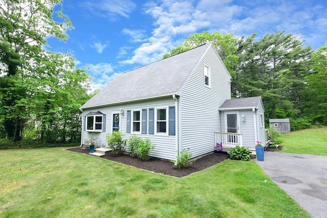 11 Winchester Ave, Bourne, MA 02532 - view of front of house with a front lawn and roof with shingles