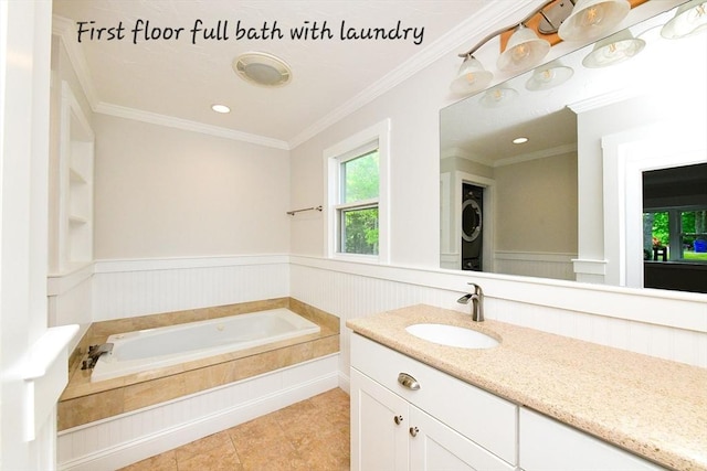 11 Winchester Ave, Bourne, MA 02532 - bathroom featuring vanity, a garden tub, wainscoting, ornamental molding, and tile patterned floors