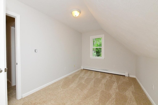11 Winchester Ave, Bourne, MA 02532 - bonus room with a baseboard heating unit, light colored carpet, lofted ceiling, and baseboards