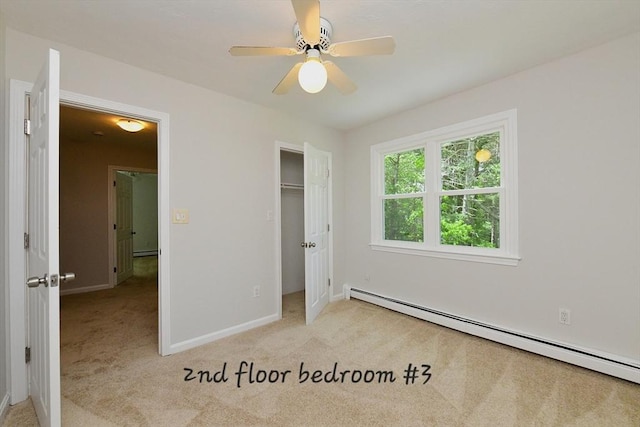 11 Winchester Ave, Bourne, MA 02532 - unfurnished bedroom with a baseboard radiator, light carpet, and baseboards