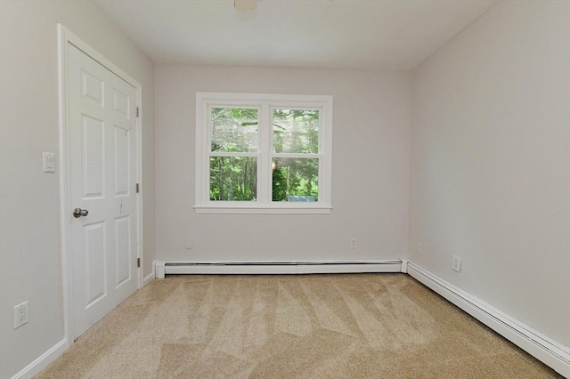 11 Winchester Ave, Bourne, MA 02532 - carpeted spare room with a baseboard radiator and baseboards
