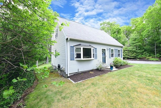 11 Winchester Ave, Bourne, MA 02532 - cape cod home with a front lawn and a shingled roof