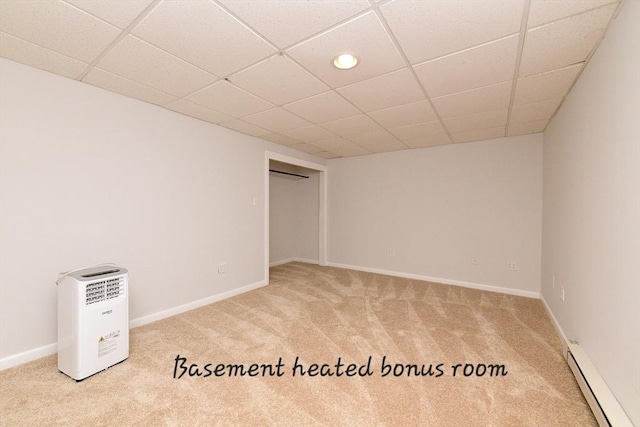 11 Winchester Ave, Bourne, MA 02532 - spare room featuring a baseboard heating unit, carpet floors, baseboards, and a drop ceiling