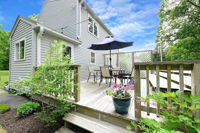 11 Winchester Ave, Bourne, MA 02532 - wooden deck featuring outdoor dining space