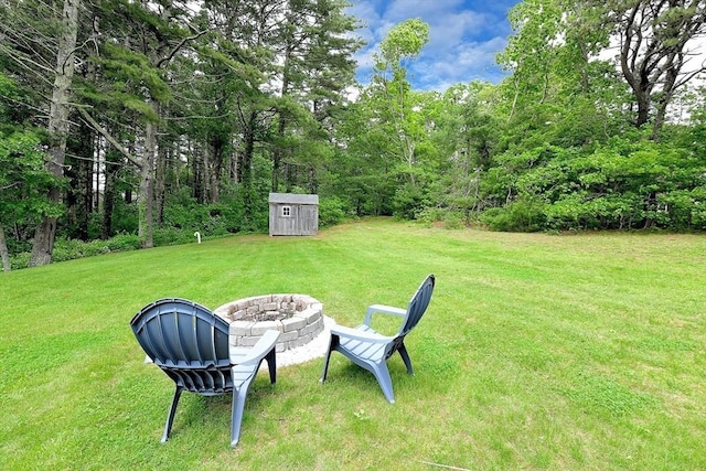11 Winchester Ave, Bourne, MA 02532 - view of grassy yard with a fire pit