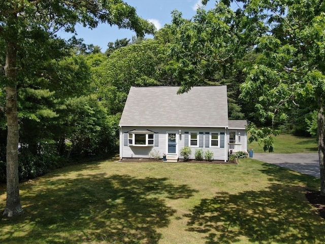 11 Winchester Ave, Bourne, MA 02532 - cape cod-style house featuring a front lawn and entry steps