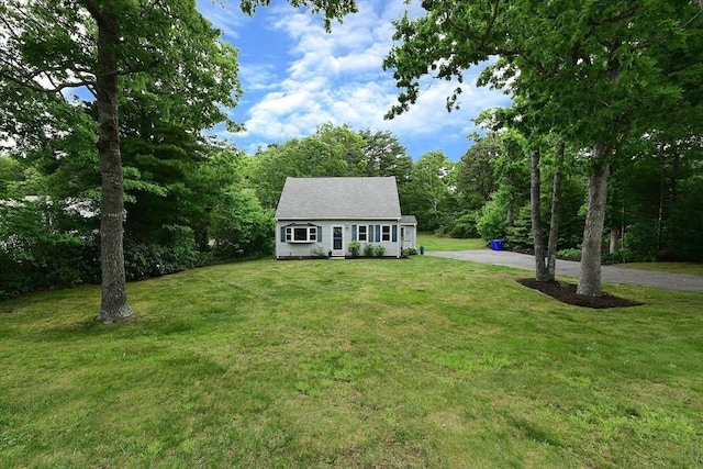 11 Winchester Ave, Bourne, MA 02532 - new england style home featuring a front yard and driveway