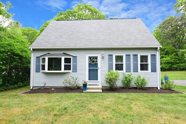 11 Winchester Ave, Bourne, MA 02532 - new england style home featuring a front yard and a shingled roof