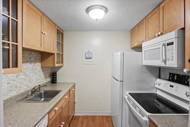 103 Grove St Unit 341, Rockland, MA 02370 - kitchen with white appliances, wood finished floors, tasteful backsplash, glass insert cabinets, and a textured ceiling