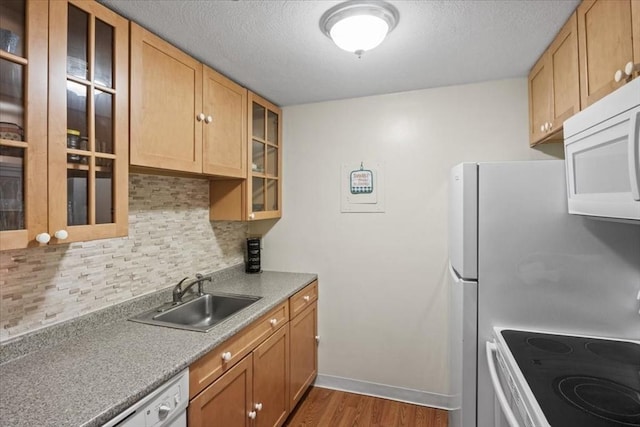 103 Grove St Unit 341, Rockland, MA 02370 - kitchen with white appliances, decorative backsplash, wood finished floors, glass insert cabinets, and a textured ceiling