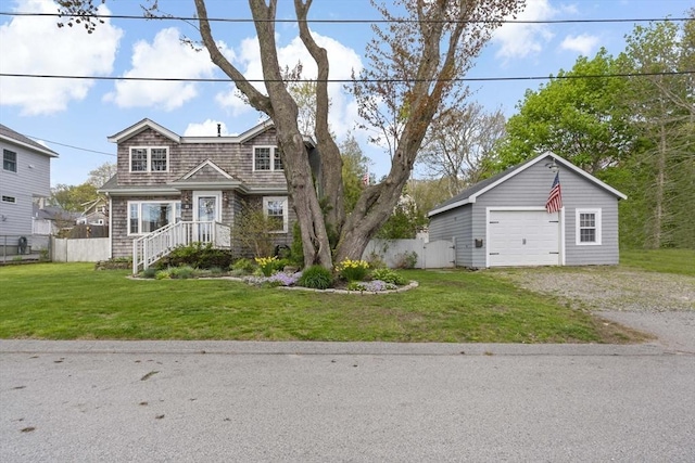 21 Grove St, Fairhaven, MA 02719 - view of front facade featuring driveway, a garage, and an outbuilding