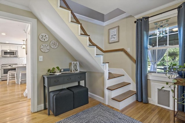 21 Grove St, Fairhaven, MA 02719 - stairway featuring wood finished floors, baseboards, crown molding, and recessed lighting