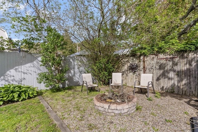 21 Grove St, Fairhaven, MA 02719 - fenced backyard with a fire pit