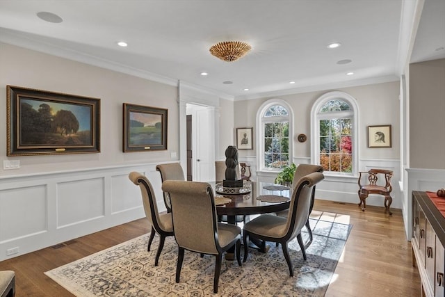 37 Radcliffe Rd, Newton, MA 02468 - dining room featuring ornamental molding, a decorative wall, and wood finished floors