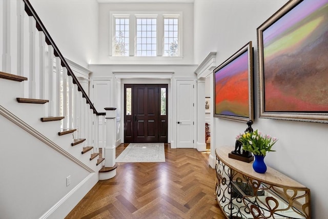 37 Radcliffe Rd, Newton, MA 02468 - foyer entrance with stairs, a high ceiling, and a healthy amount of sunlight