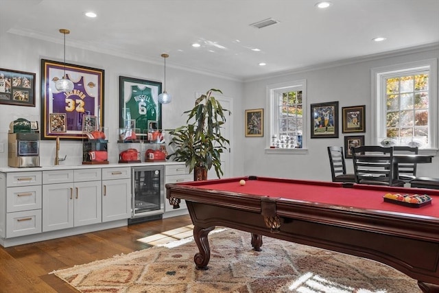 37 Radcliffe Rd, Newton, MA 02468 - rec room featuring crown molding, beverage cooler, indoor wet bar, recessed lighting, and wood finished floors