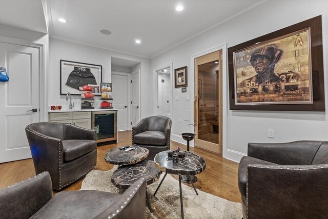 37 Radcliffe Rd, Newton, MA 02468 - living room with recessed lighting, bar, wine cooler, and wood finished floors