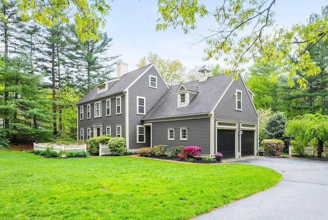 126 Arrow Head Rd, Marshfield, MA 02050 - view of front of house featuring driveway, a front yard, a garage, and roof with shingles
