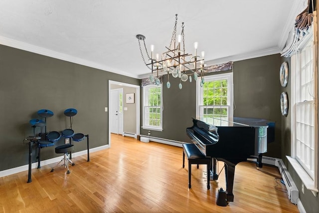 126 Arrow Head Rd, Marshfield, MA 02050 - living area featuring a chandelier, crown molding, wood finished floors, baseboards, and a baseboard radiator