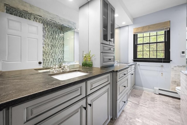 126 Arrow Head Rd, Marshfield, MA 02050 - bathroom with a baseboard heating unit, double vanity, baseboards, and recessed lighting