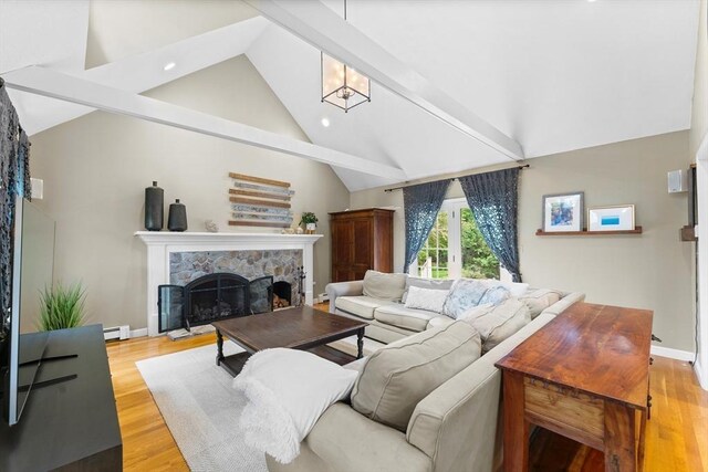126 Arrow Head Rd, Marshfield, MA 02050 - living room featuring baseboard heating, a stone fireplace, beamed ceiling, light wood-style floors, and recessed lighting