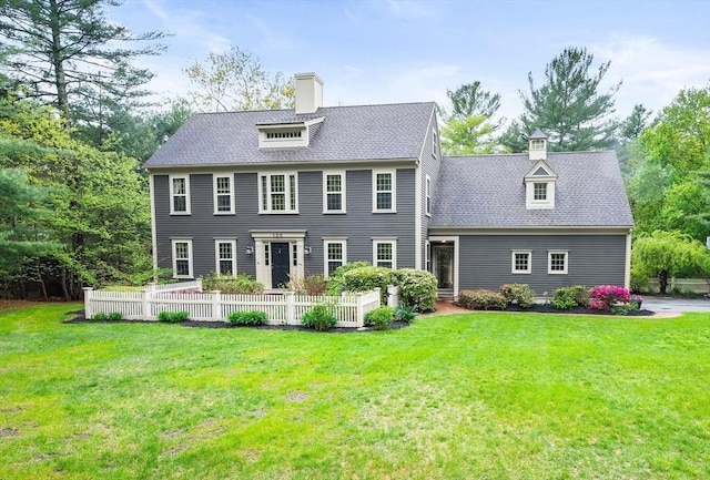 126 Arrow Head Rd, Marshfield, MA 02050 - colonial house featuring a chimney and a front lawn