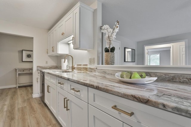 181 Littleton Rd Unit 213, Chelmsford, MA 01824 - kitchen with a sink, white cabinets, and light wood-style floors