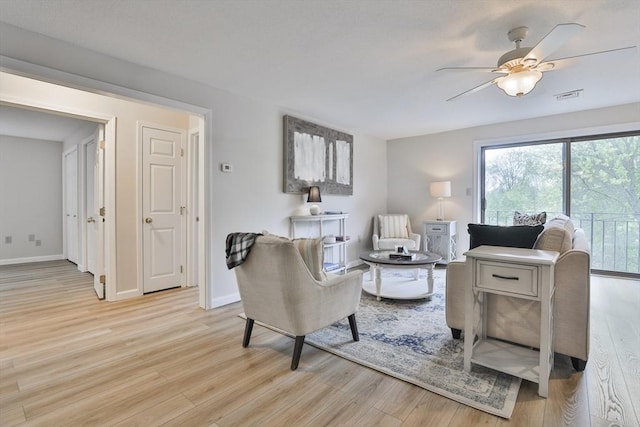 181 Littleton Rd Unit 213, Chelmsford, MA 01824 - living room with plenty of natural light, light wood-style flooring, and a ceiling fan