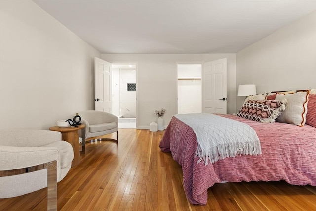 bedroom with light wood finished floors