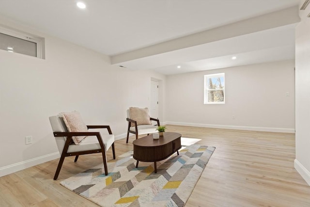 sitting room with light wood finished floors, baseboards, and recessed lighting