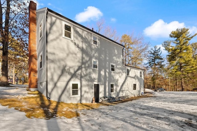 view of side of property featuring a chimney