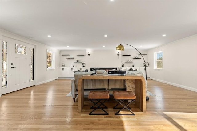 dining area with a healthy amount of sunlight, recessed lighting, and light wood-style floors