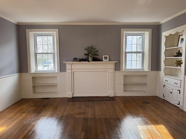 unfurnished dining area with a healthy amount of sunlight, dark hardwood / wood-style flooring, and crown molding