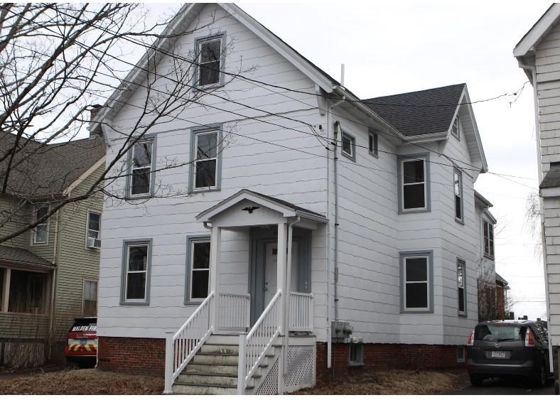 view of front of home with a shingled roof