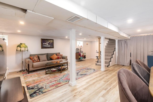 living room featuring visible vents, wood finished floors, stairway, baseboards, and recessed lighting