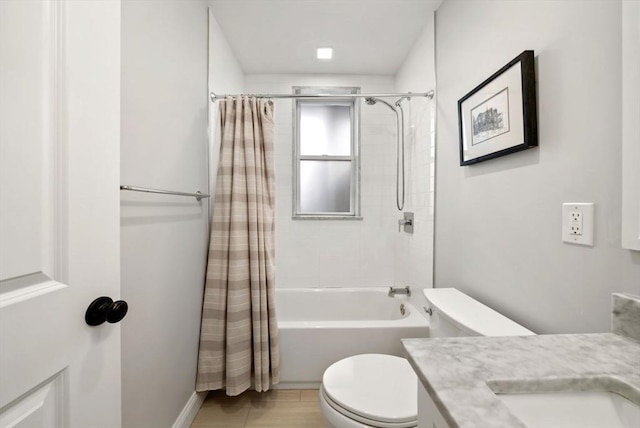 bathroom with shower / tub combo, vanity, and toilet