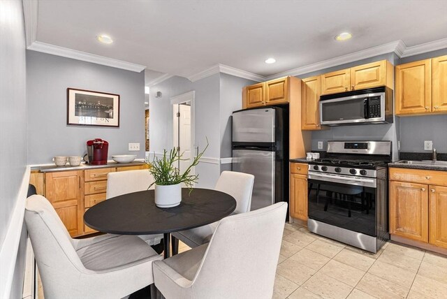 9-11 Linley Ter Unit 2, Boston, MA 02127 - kitchen with appliances with stainless steel finishes, dark countertops, recessed lighting, ornamental molding, and light tile patterned flooring
