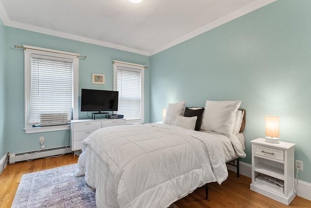 9-11 Linley Ter Unit 2, Boston, MA 02127 - bedroom with a baseboard heating unit, ornamental molding, light wood-style floors, and baseboards