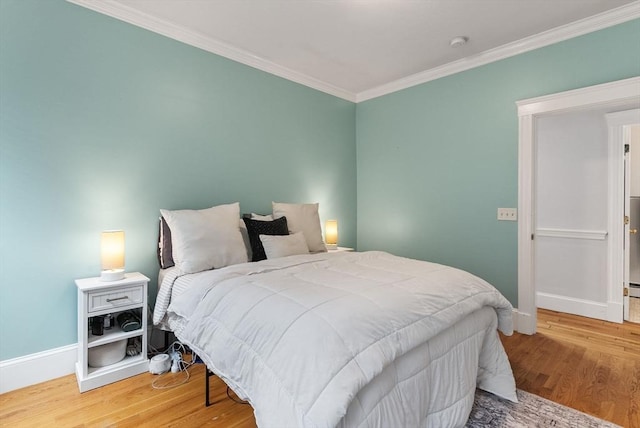 9-11 Linley Ter Unit 2, Boston, MA 02127 - bedroom with ornamental molding, baseboards, and wood finished floors
