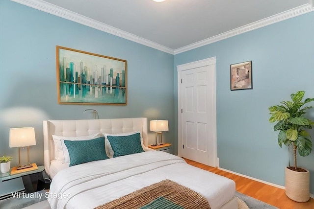 9-11 Linley Ter Unit 2, Boston, MA 02127 - bedroom featuring ornamental molding, wood finished floors, and baseboards