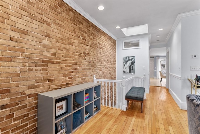 9-11 Linley Ter Unit 2, Boston, MA 02127 - hall with ornamental molding, a skylight, an upstairs landing, brick wall, and light wood-style flooring