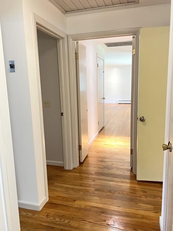 216 Bel Air Dr, Longmeadow, MA 01106 - hall with light wood-style flooring and baseboard heating