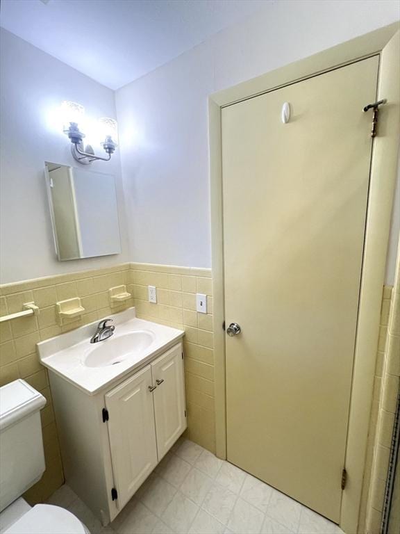 216 Bel Air Dr, Longmeadow, MA 01106 - bathroom with tile walls, vanity, and a wainscoted wall