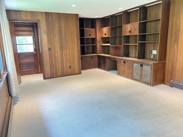 216 Bel Air Dr, Longmeadow, MA 01106 - carpeted empty room with built in study area, wood walls, and recessed lighting