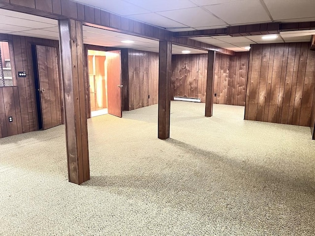 216 Bel Air Dr, Longmeadow, MA 01106 - finished below grade area featuring a drop ceiling, carpet floors, a baseboard radiator, and wood walls